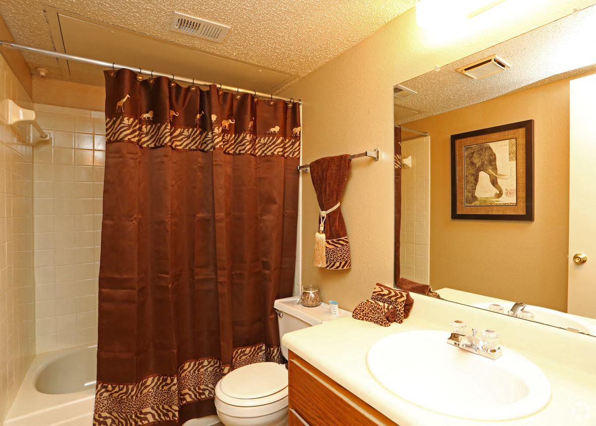 a bathroom with a sink toilet and a shower