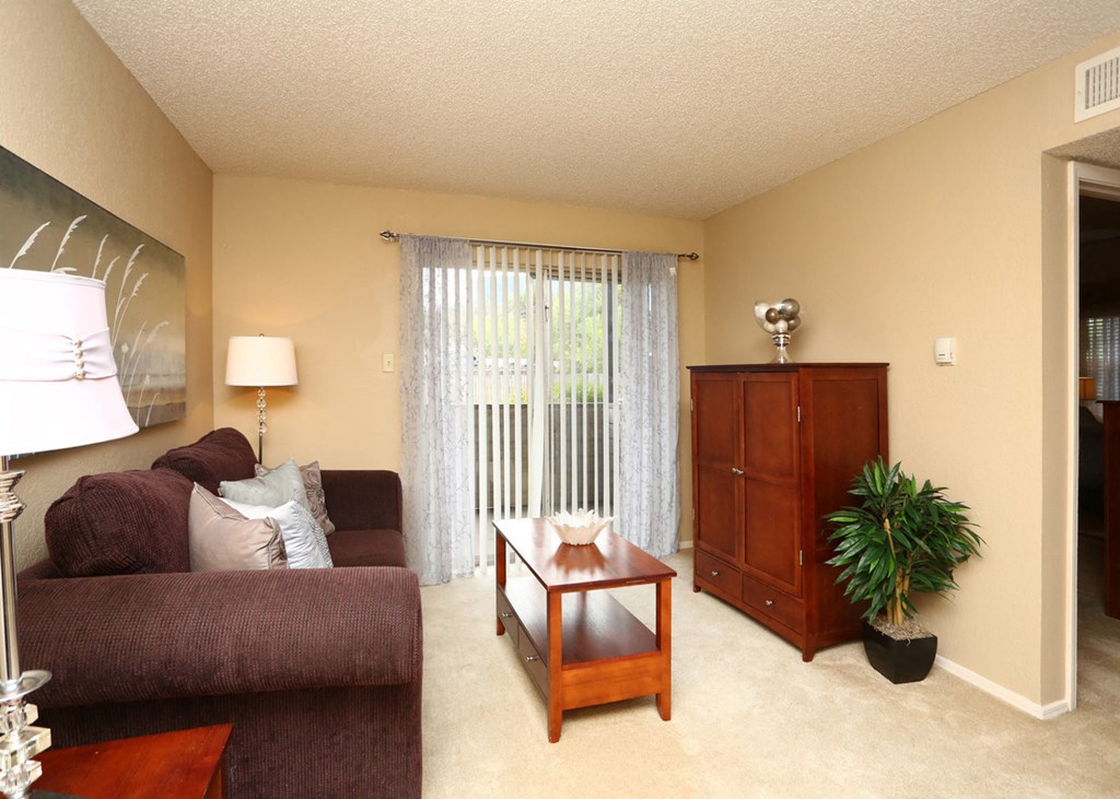 a living room with a couch and a table