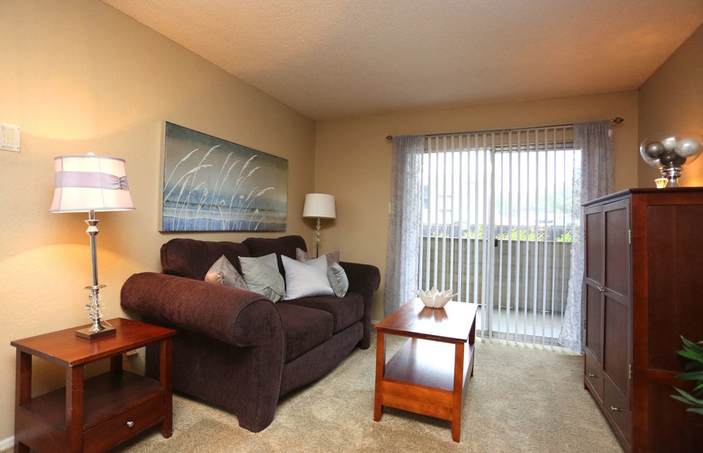 a living room with a couch and a table