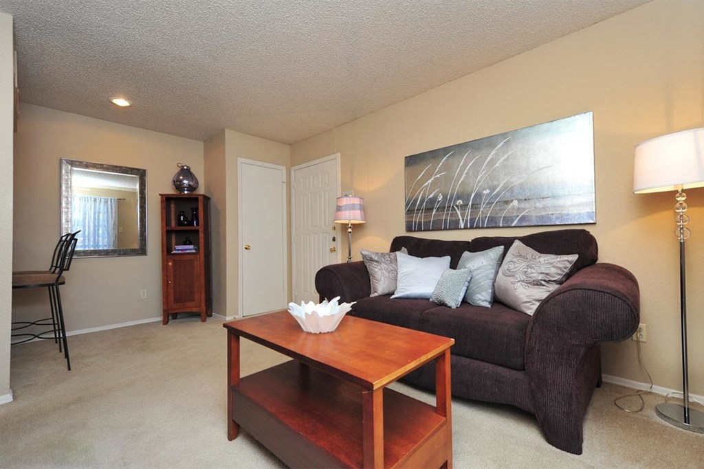 a living room with a couch and a coffee table