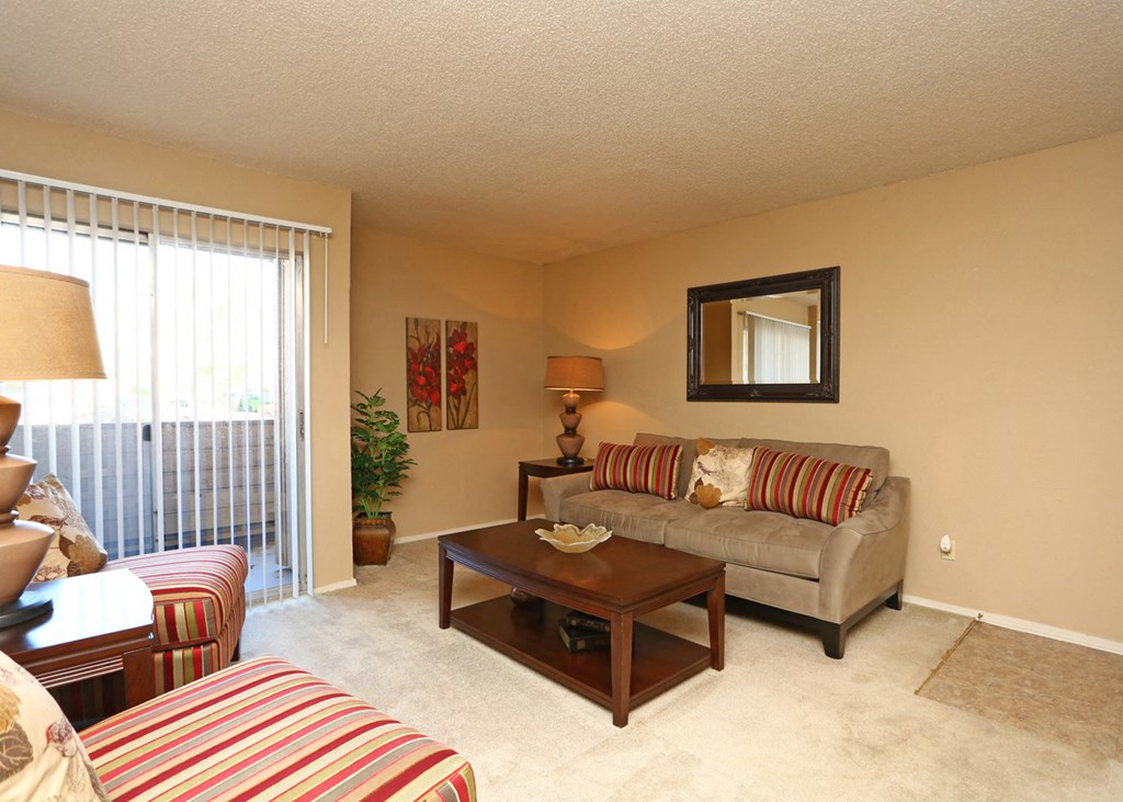 a living room with a couch and a table