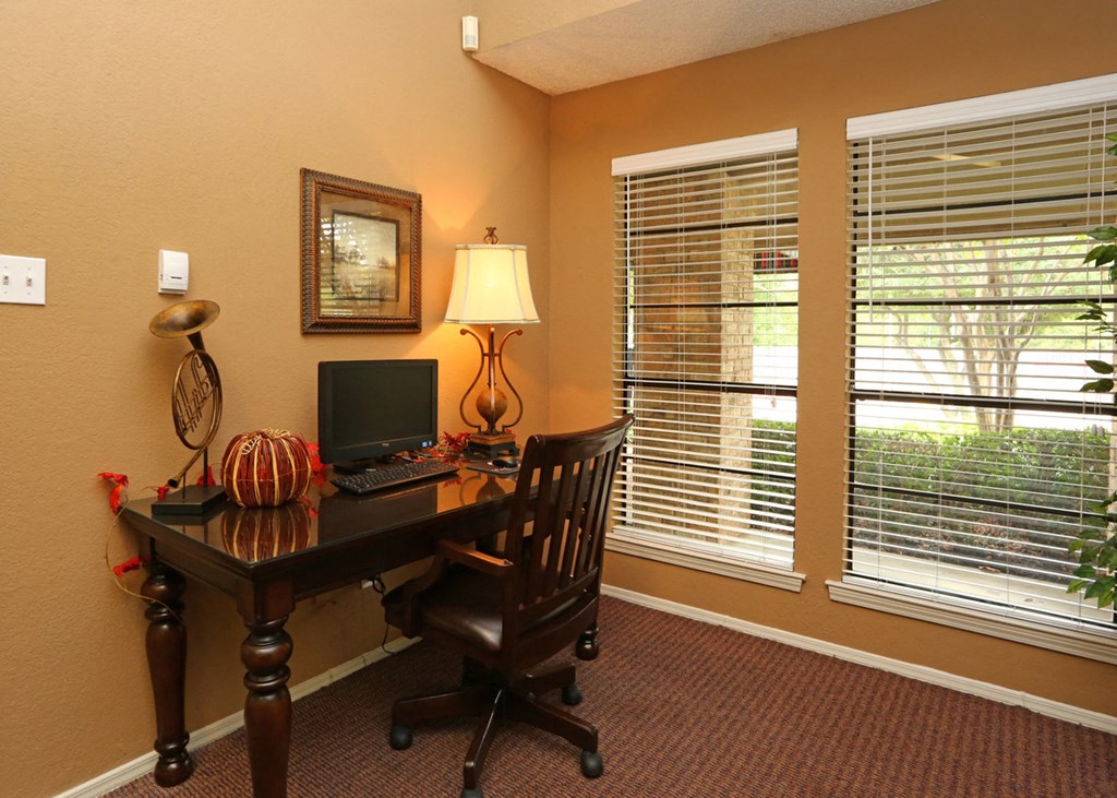 a home office with a desk and a computer