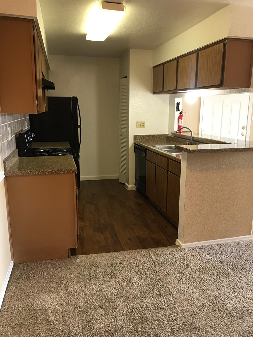 a view of a kitchen from the living room