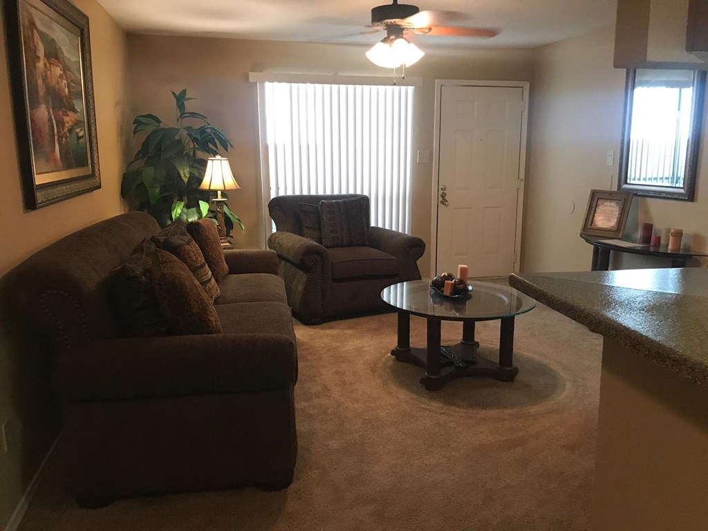 a living room with couches and a coffee table