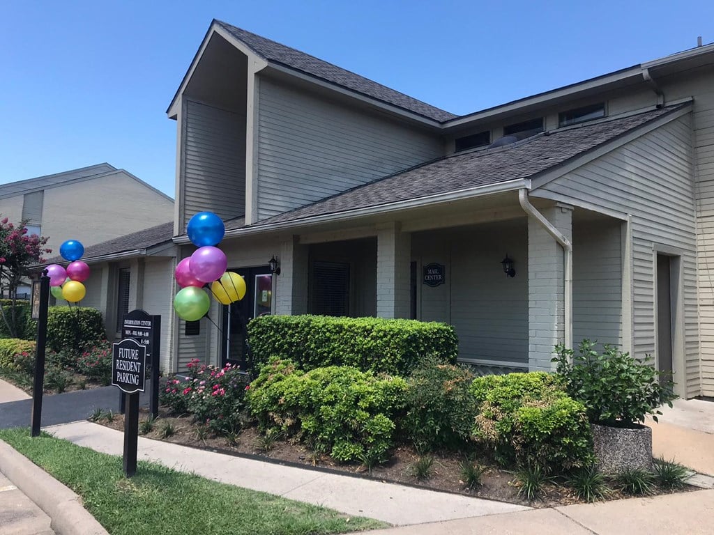 a house with balloons in front of it