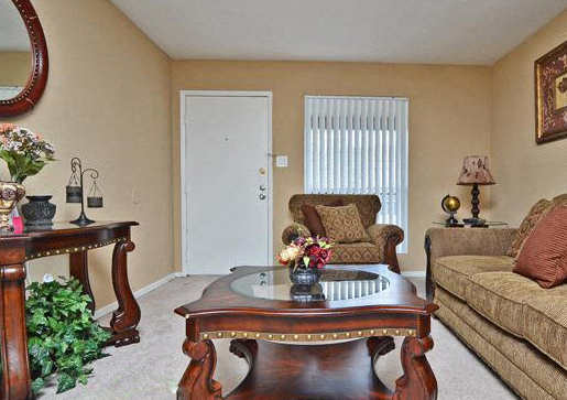 a living room with a coffee table and a couch