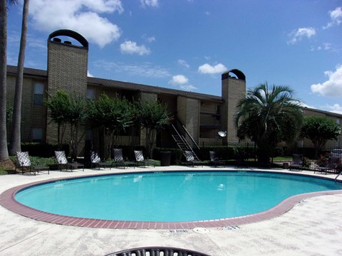 a swimming pool in front of a hotel