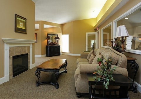 a living room with a couch and a fireplace