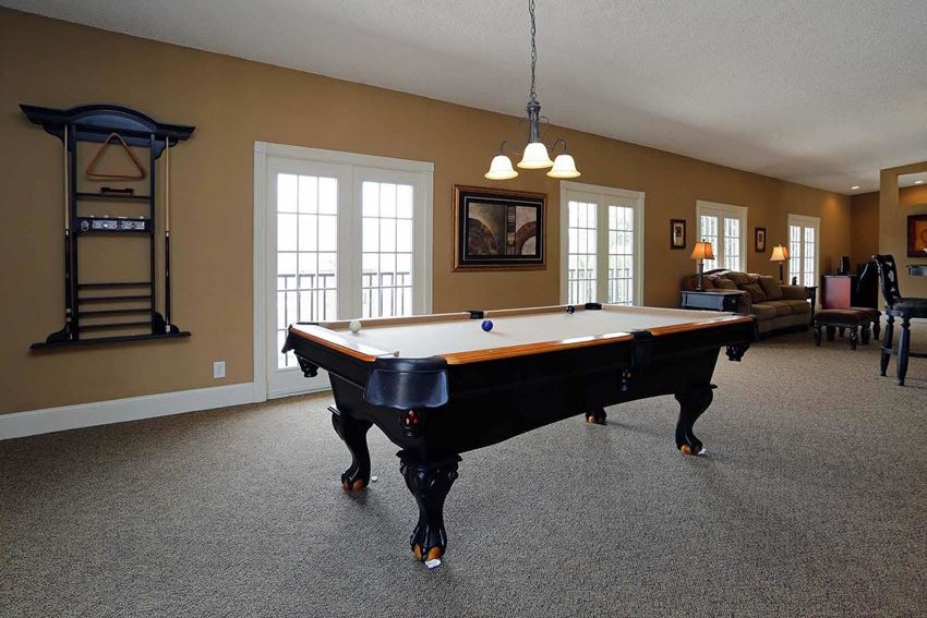 a pool table in the middle of a living room