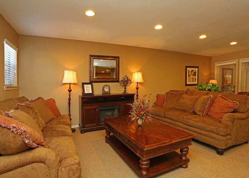 a living room with couches and a coffee table