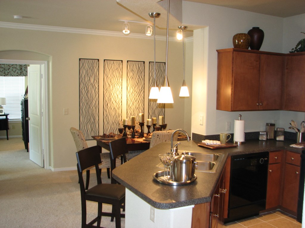 an open kitchen and dining room with a table and chairs