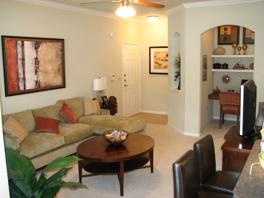 a living room with a couch and a table