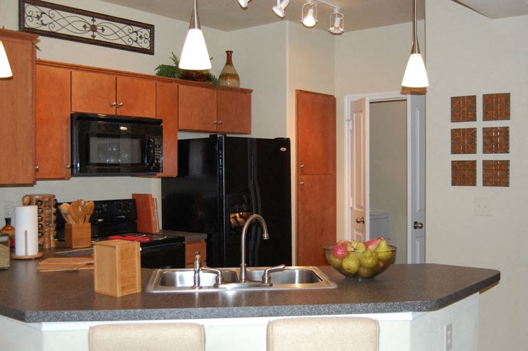 a kitchen with a sink and a counter top