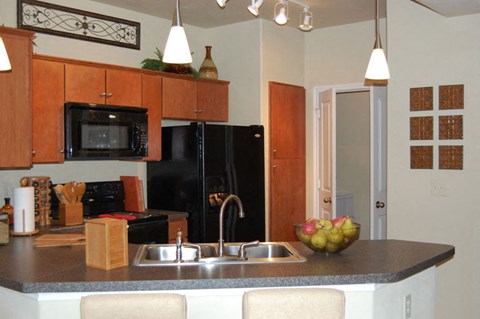 a kitchen with a sink and a counter top