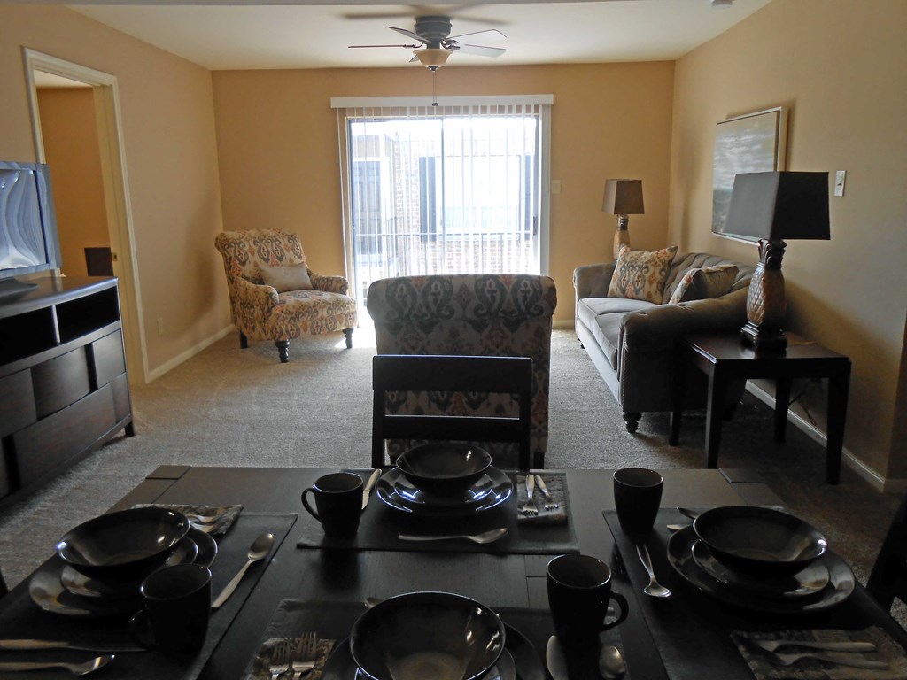 a view of the living room from behind the dining room table