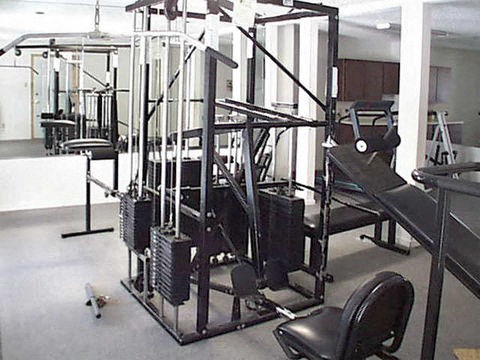 a gym with a lot of exercise equipment in it