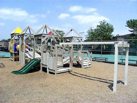a playground with a slide and benches