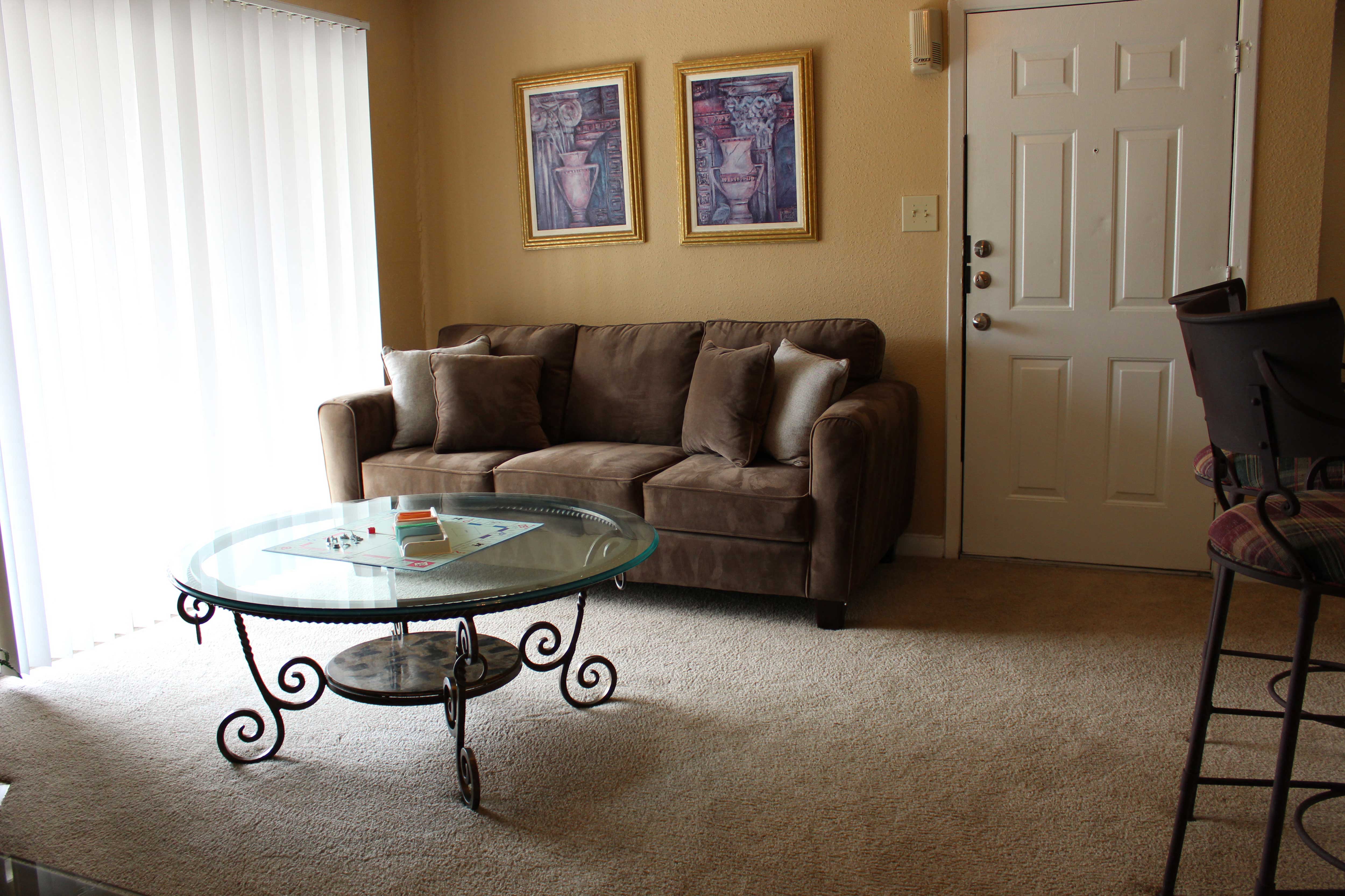 a living room with a couch and a table