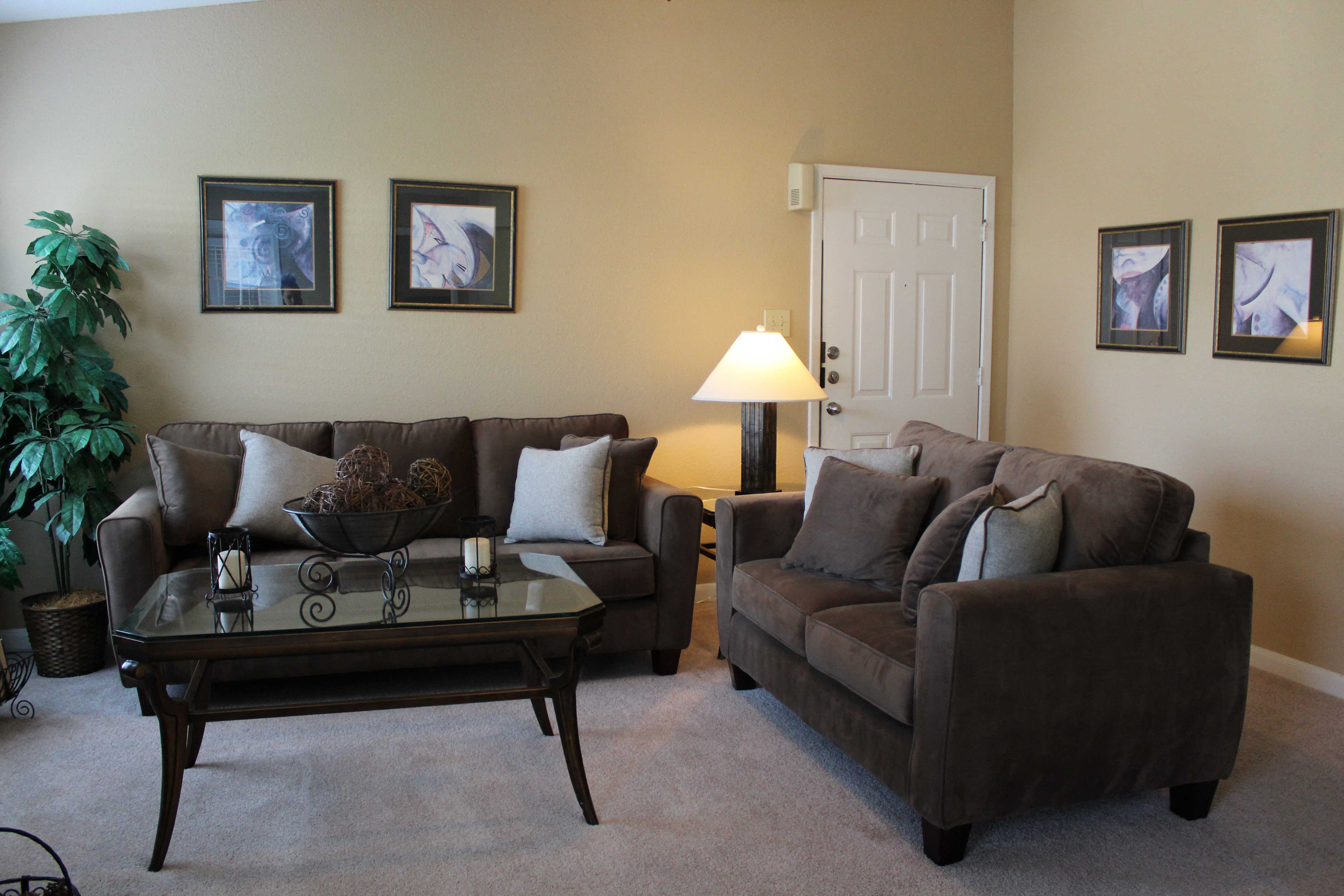 a living room with couches and a coffee table