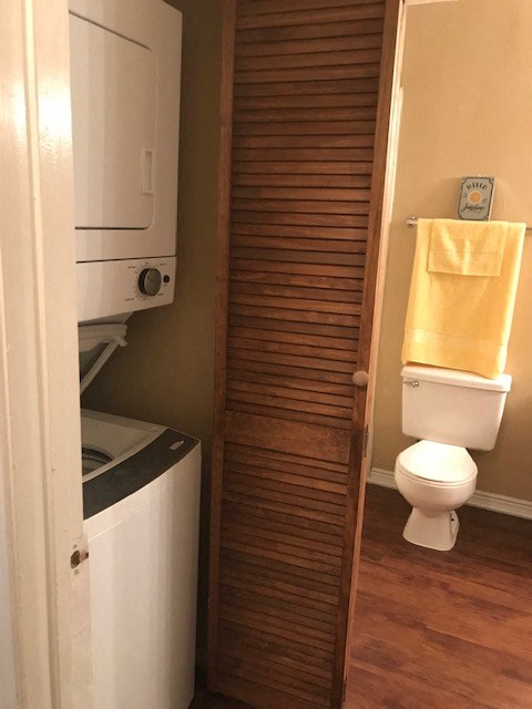 a bathroom with a toilet and a towel rack