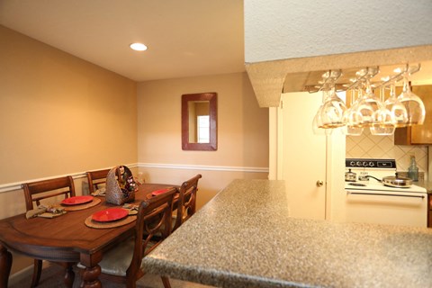a kitchen with a dining table and a counter top