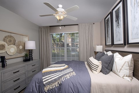 Indianapolis Lake Clearwater Apartments bedroom with large window and ceiling fan