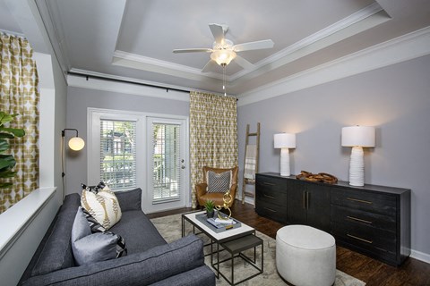 Indianapolis Lake Clearwater Apartments living room with crown molding and tray ceiling