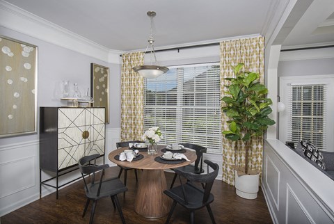 Indianapolis Lake Clearwater Apartments dining area with crown molding and judges panels