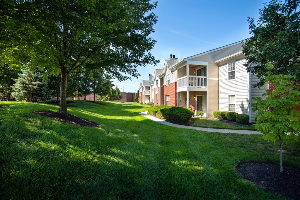 Indianapolis The Lakes Apartments building exterior with expansive greenspace