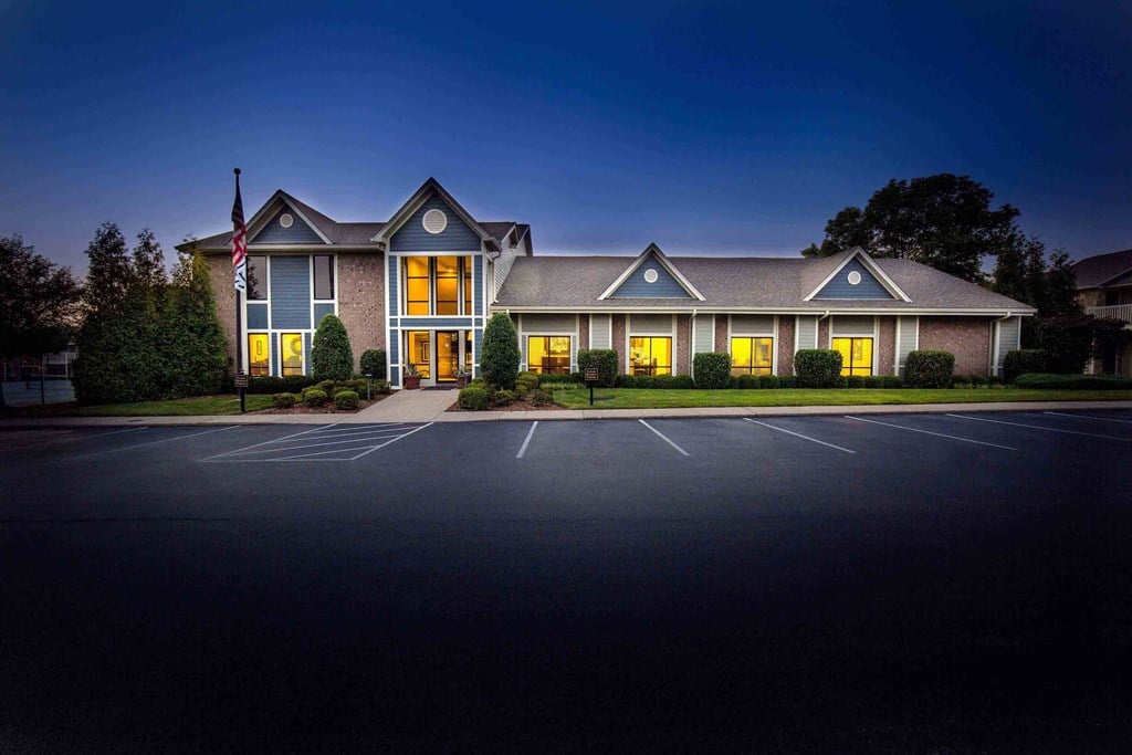 Louisville Plainview Apartments leasing center and clubhouse entrance at dusk