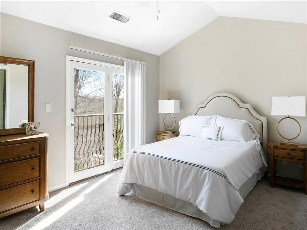The Overlook at St. Thomas Apartments Louisville primary bedroom with vaulted ceiling