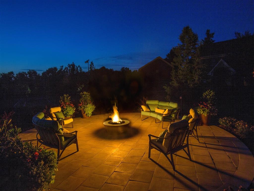 The Overlook at St. Thomas Apartments Louisville firepit at dusk