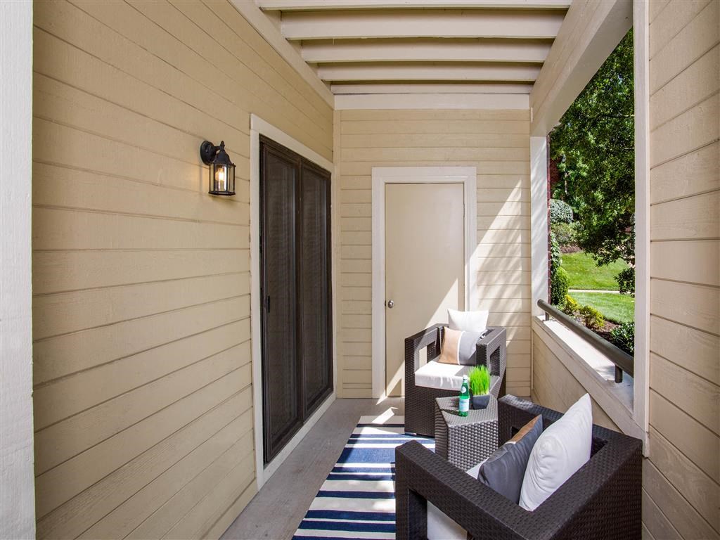 The Overlook at St. Thomas Apartments Louisville covered patio with storage