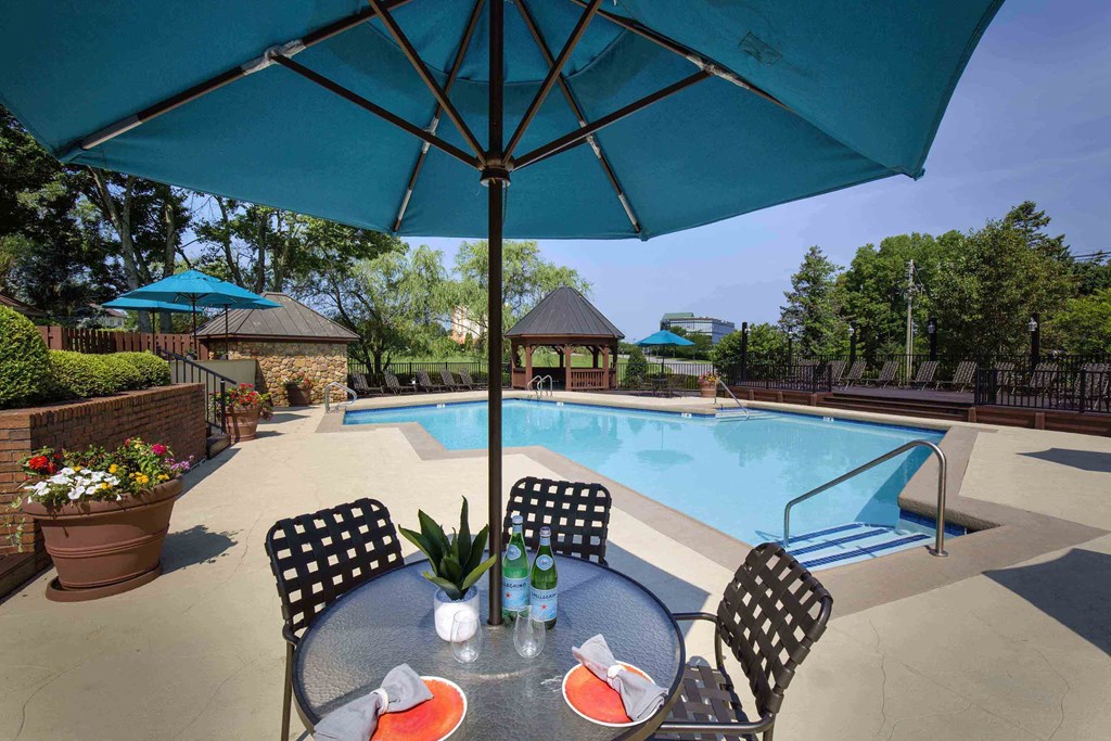 The Willows Apartments Louisville resort-style pool with dining area The Willows Apartments Louisville resort-style pool with dining area