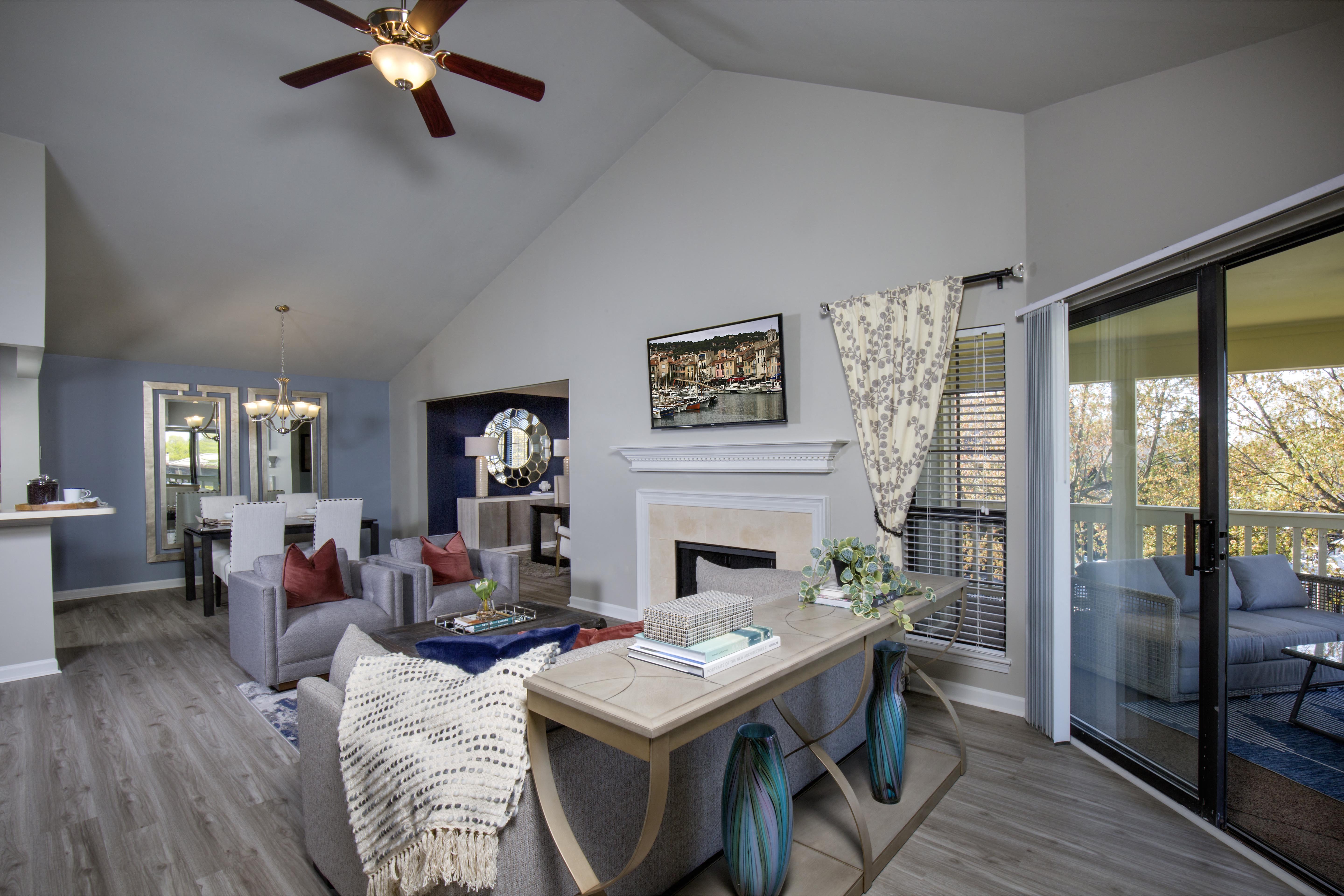Lexington Park Place Apartments living room with vaulted ceiling and fireplace