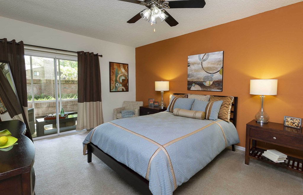 Longwood Sabal Park Apartments spacious primary bedroom with patio access Longwood Sabal Park Apartments spacious primary bedroom with patio access