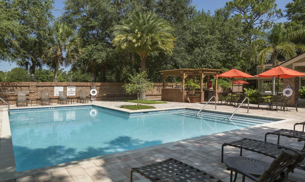 Resort-style pool and expansive sundeck with lounge seatingLongwood Sabal Park Apartments resort-style pool and expansive sundeck Longwood Sabal Park Apartments resort-style pool and expansive sundeck