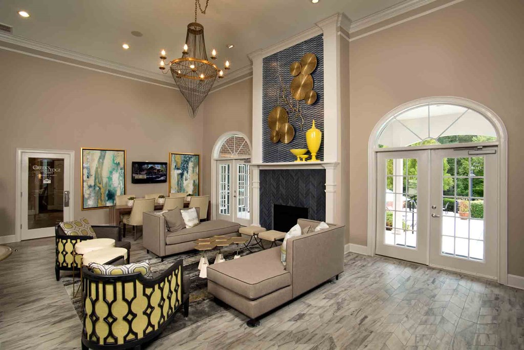 Creek's Edge Apartments Richmond Virginia resident lounge with fireplace and plush seating