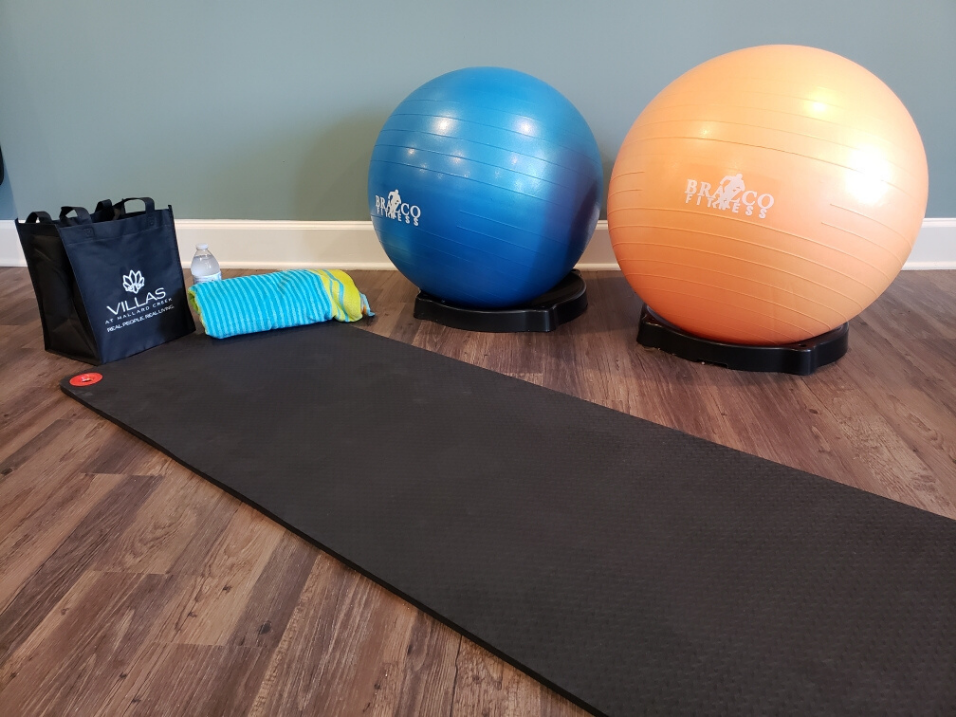 yoga mat and exercise balls in fitness center