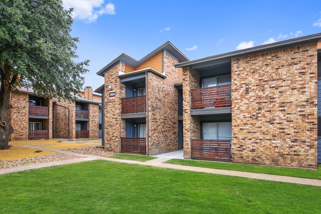 our apartments offer a spacious courtyard with green grass