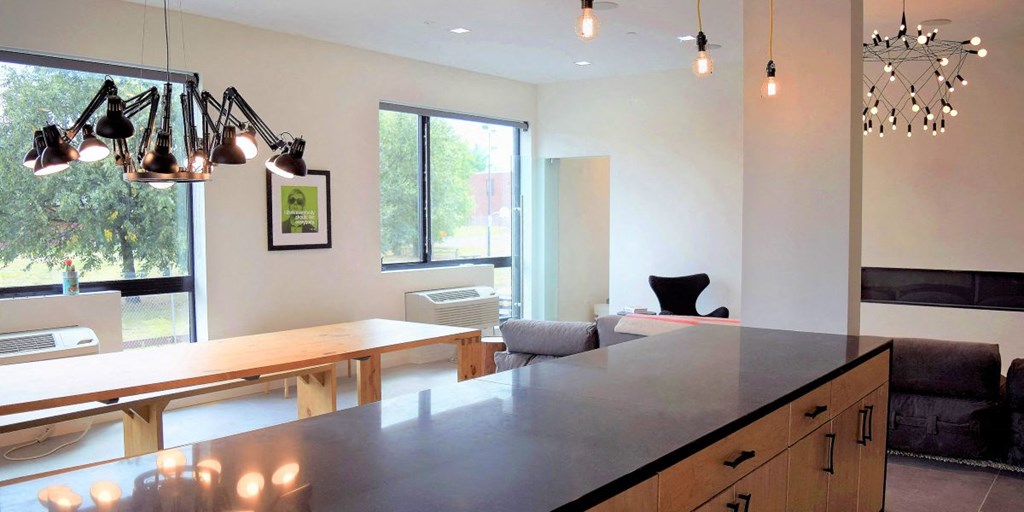 a kitchen with a counter top and a dining table