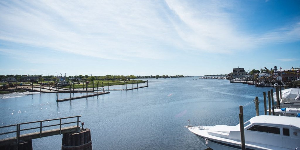 a boat is docked at a dock on the water