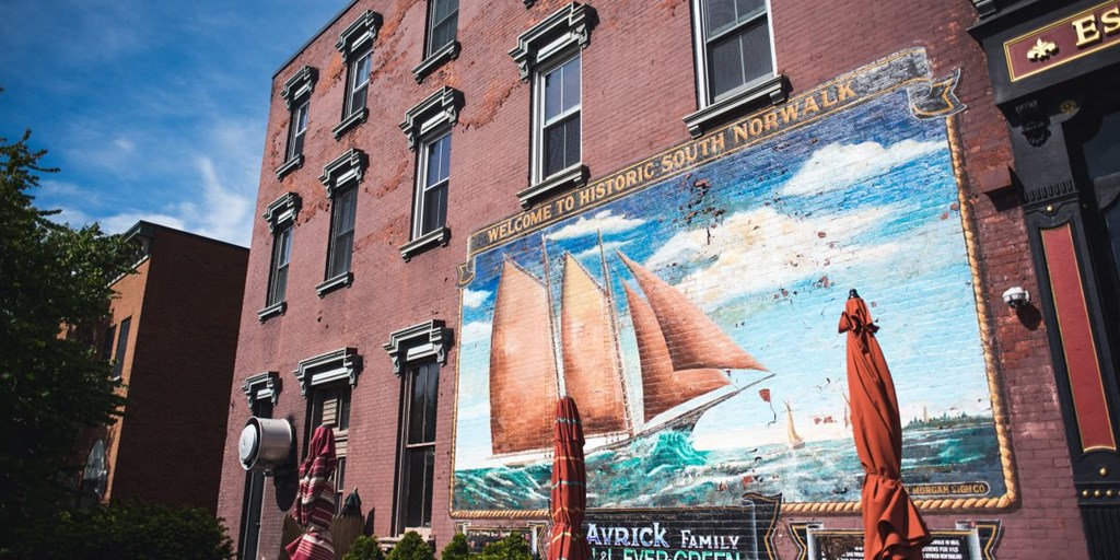 a mural on the side of a brick building