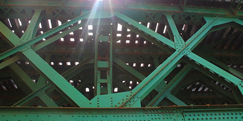 a close up of the steel beams of a bridge