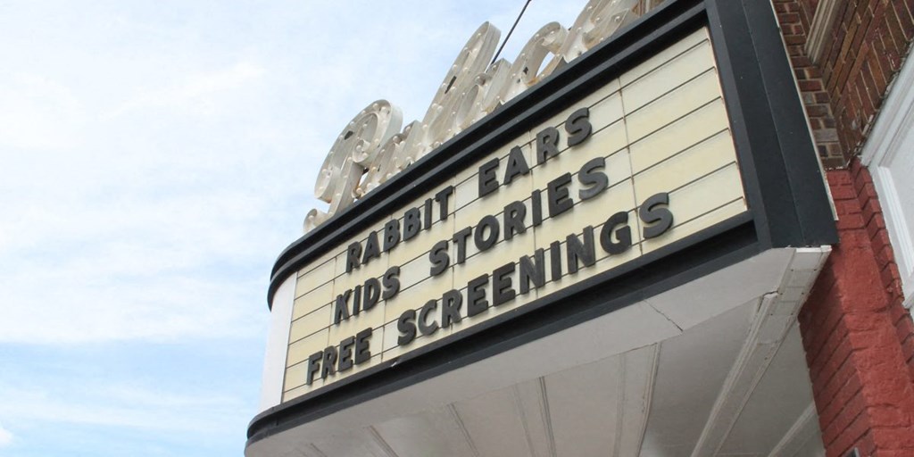 an old sign on the side of a building