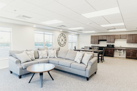 a living room with a couch and a table