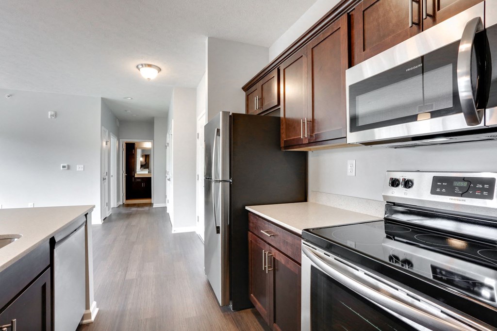 renovated kitchen with stainless steel appliances at the district flats apartments in lenexa
