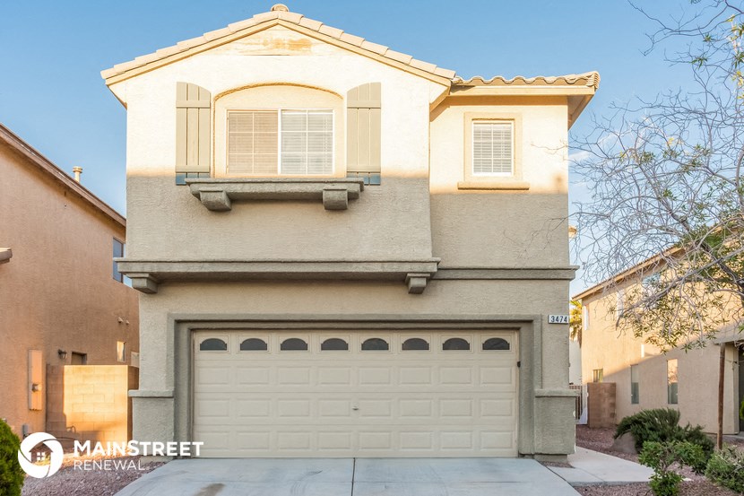 a white house with a white garage door
