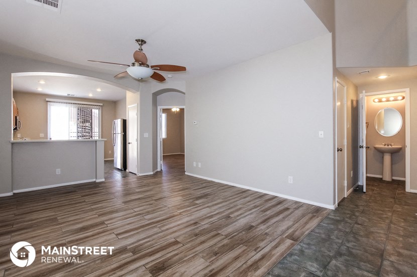 the living room is open to the dining room and kitchen