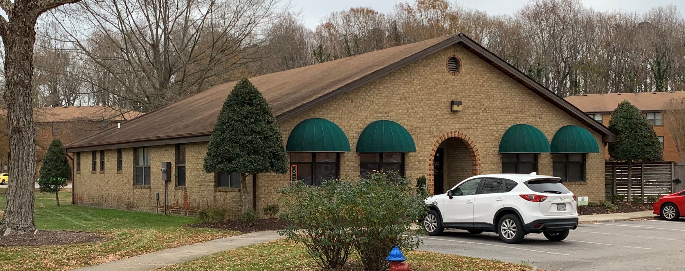 a car parked in front of a church building
